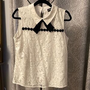 White lace Karl lagerfeld top with black bow and floral accents